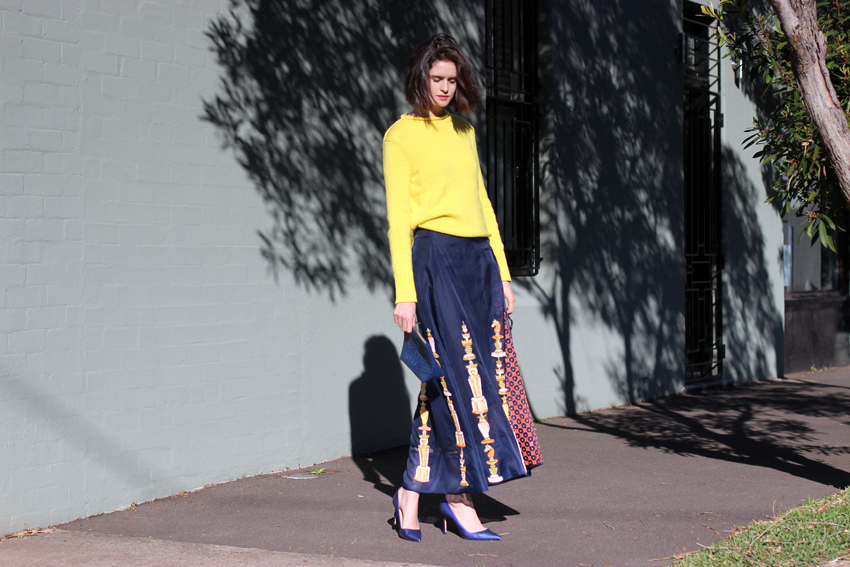 Chloe-C-Hill-in-Cos-yellow-jumper,-after-the-apple-clutch,-Easton-Pearson-beaded-full-legnth-skirt-and-manolo-Blahnik-blue-heels