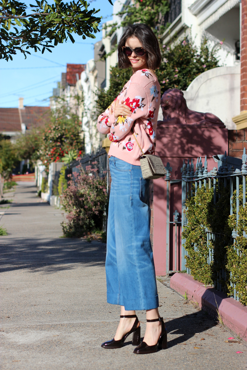 Chloe-Hill-Wearing-Kate-Sylvester-floral-knit-jumper,-Gucci-blue-wide-leg-jeans-and-Bottega-Venetta-patent-heels-on-the-streets-of-sydney