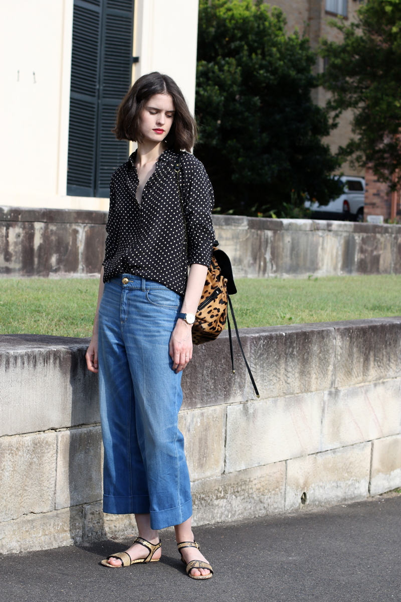 Chloe-Hill-in-the-fable-spotted-silk-shirt,-gucci-wide-leg-jeans-and-marni-python-sandals-outside-Elizabeth-Bay-House-in-Sydney