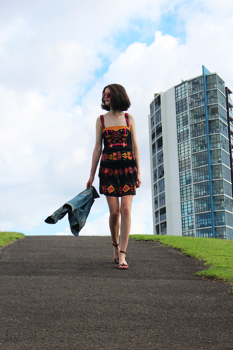 Chloe Hill Wearing Citizens of Humanity Denim Jacket, Easton Pearson beaded top and skirt, Pared eyewear orange sunglasses and Furla yellow metropolis bag in Sydney