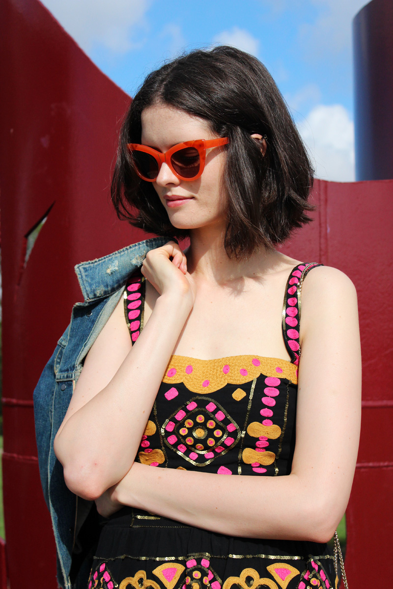 Chloe Hill Wearing Citizens of Humanity Denim Jacket, Easton Pearson beaded top and skirt, Pared eyewear orange sunglasses and Furla yellow metropolis bag