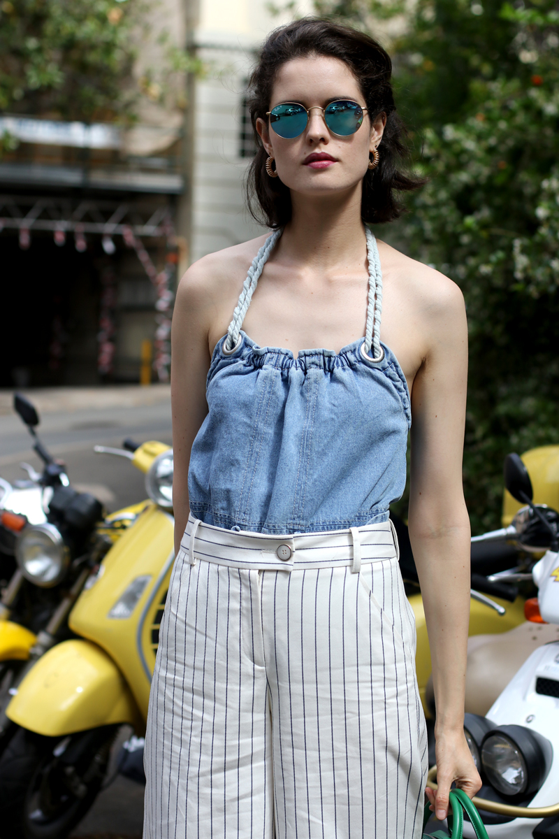 Chloe-Hill-Wearing-Karen-Walker-Resort-denim-top,-Kate-Sylvester-pinstripe-culottes-and-rayban-blur-round-reflective-sunglasses-from-the-sunglass-hut-in-Elizabeth-Bay,-Sydney-Australia