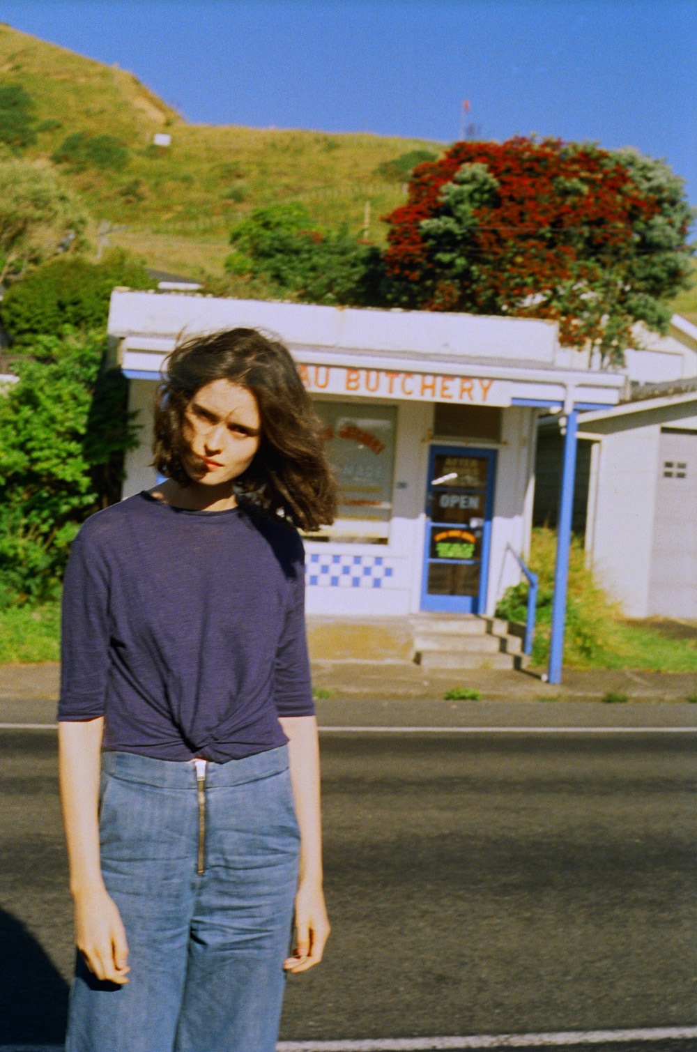 CHLOE CHILL TRAVEL Wearing Thursday Sunday top and Vale denim jeans outside Mokau Butcher