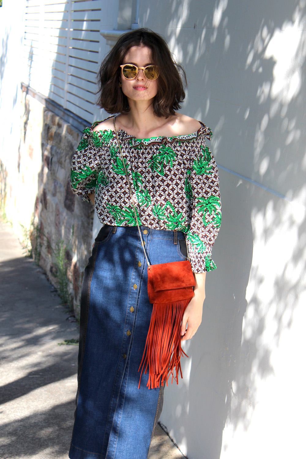 Chloe Hill wearing Easton Pearson off the shoulder tropical print top, Eugenie NZ denim midi skirt and karen millen suede fringed bag