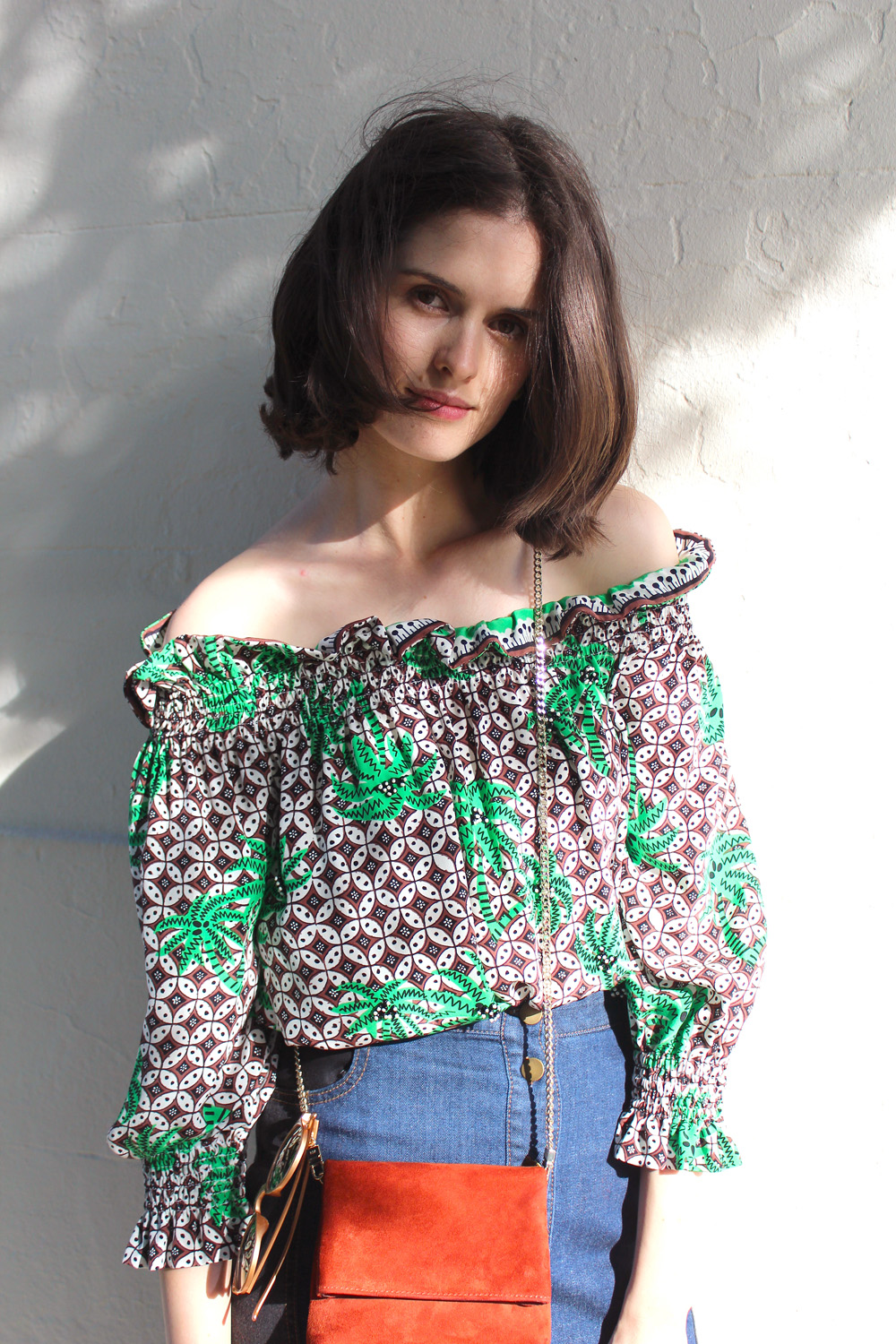 Chloe Hill wearing Easton Pearson off the shoulder tropical print top and karen millen suede fringed bag